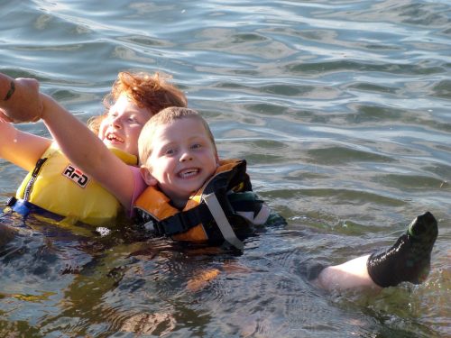 Skye and Callum testing their PFD's before a paddle in the River Axe